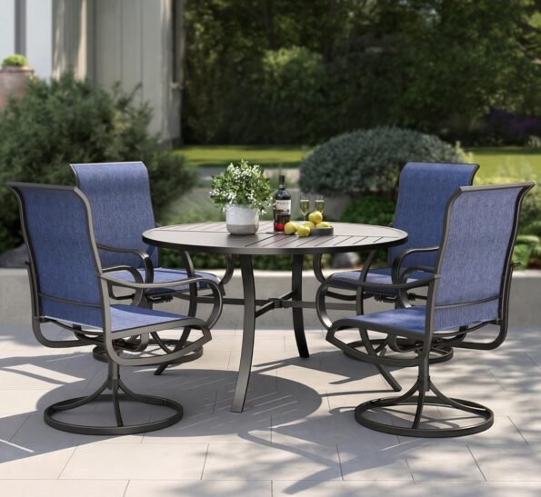 Five piece swivel rocking patio dining set on a garden terrace